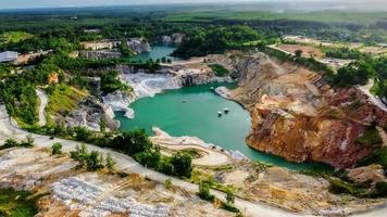 A large hole formed by mining, the view is quaint and beautiful. mining industry concept photo
