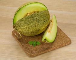 Melon on wooden background photo