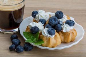 Profiterole with blueberry photo