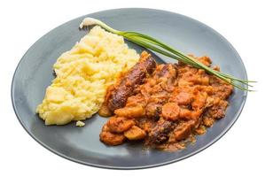 Dublin coddle on the plate and white background photo