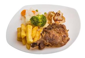 T-bone steak on the plate and white background photo