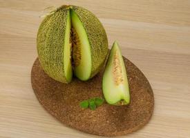 Melon on wooden background photo