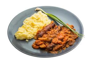 Dublin coddle on the plate and white background photo