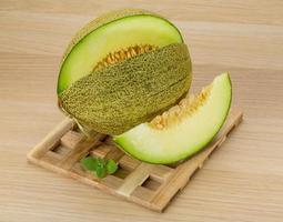 Melon on wooden background photo