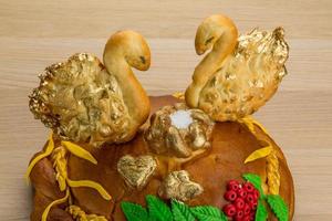 Karavay - Russian traditional bread on wooden background photo