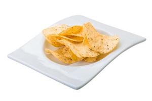 Potato chips in a bowl on white background photo