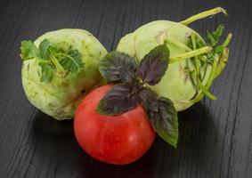 Kohlrabi on wooden background photo