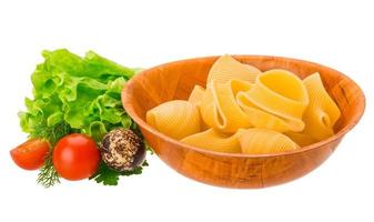 Raw pasta in a bowl on white background photo