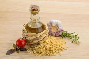 Kids pasta on wooden background photo