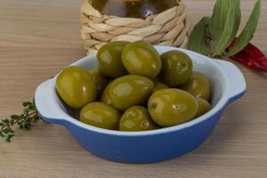 Marinated green olives photo