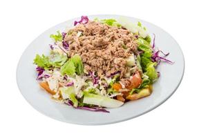 Tuna salad on the plate and white background photo