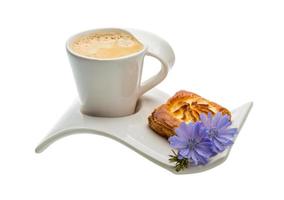 Coffee with pastry on white background photo