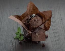 Chocolate muffin on wooden background photo