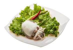 Boiled cuttlefish on the plate and white background photo