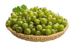 Gooseberry in a basket on white background photo