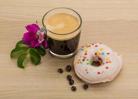 Glazed donuts on wooden background photo