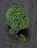 Broccoli on wooden background photo