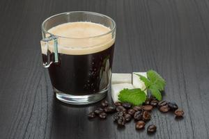 Espresso on wooden background photo