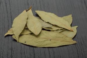 Laurel on wooden background photo