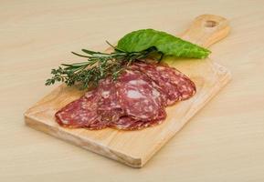 Sliced salami on a board photo