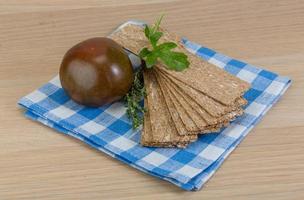 Stack of crispbread on tartan napkin photo