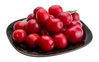 Damson plum on the plate and white background photo