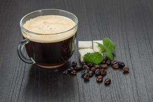 Espresso on wooden background photo