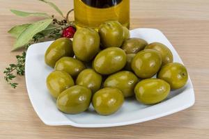 Marinated green olives photo