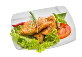 Baracuda steak on the plate and white background photo