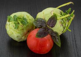 Kohlrabi on wooden background photo