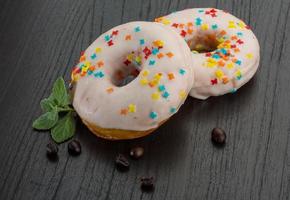 Donut on wooden background photo