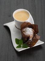 Coffee with muffin on wooden background photo