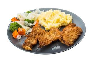 schnitzel on the plate and white background photo