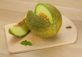 Melon on wooden background photo