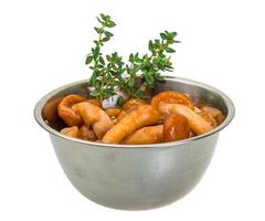 Armillaria in a bowl on white background photo