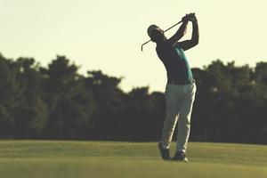 golfer hitting long shot photo