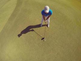 top view of golf player hitting shot photo