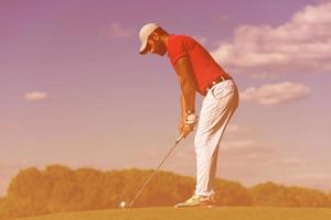 golf player hitting long shot photo