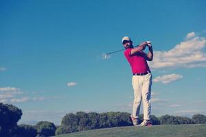 golf player hitting long shot photo