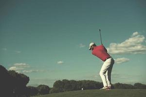 golf player hitting long shot photo