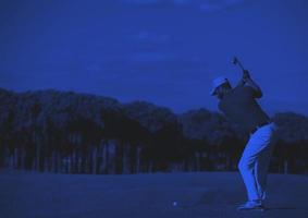 golf player hitting long shot photo