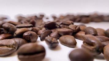 f coffee on a white table with coffee beans. Stock video footage.