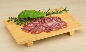 Sliced salami on a board photo