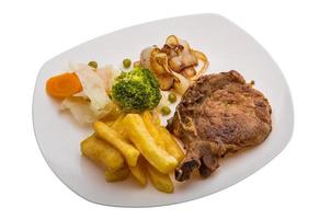 T-bone steak on the plate and white background photo