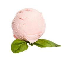 Scoop of strawberry ice cream from top on white background with mint photo