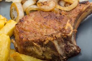 T-bone steak on the plate and white background photo