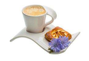 Coffee with pastry on white background photo