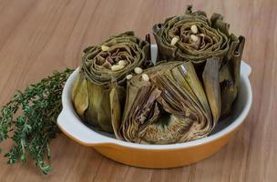 Boiled artichokes in a bowl photo