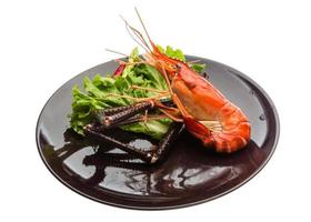 Giant Freshwater Prawn on the plate and white background photo