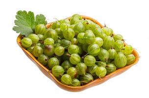 Gooseberry in a bowl on white background photo